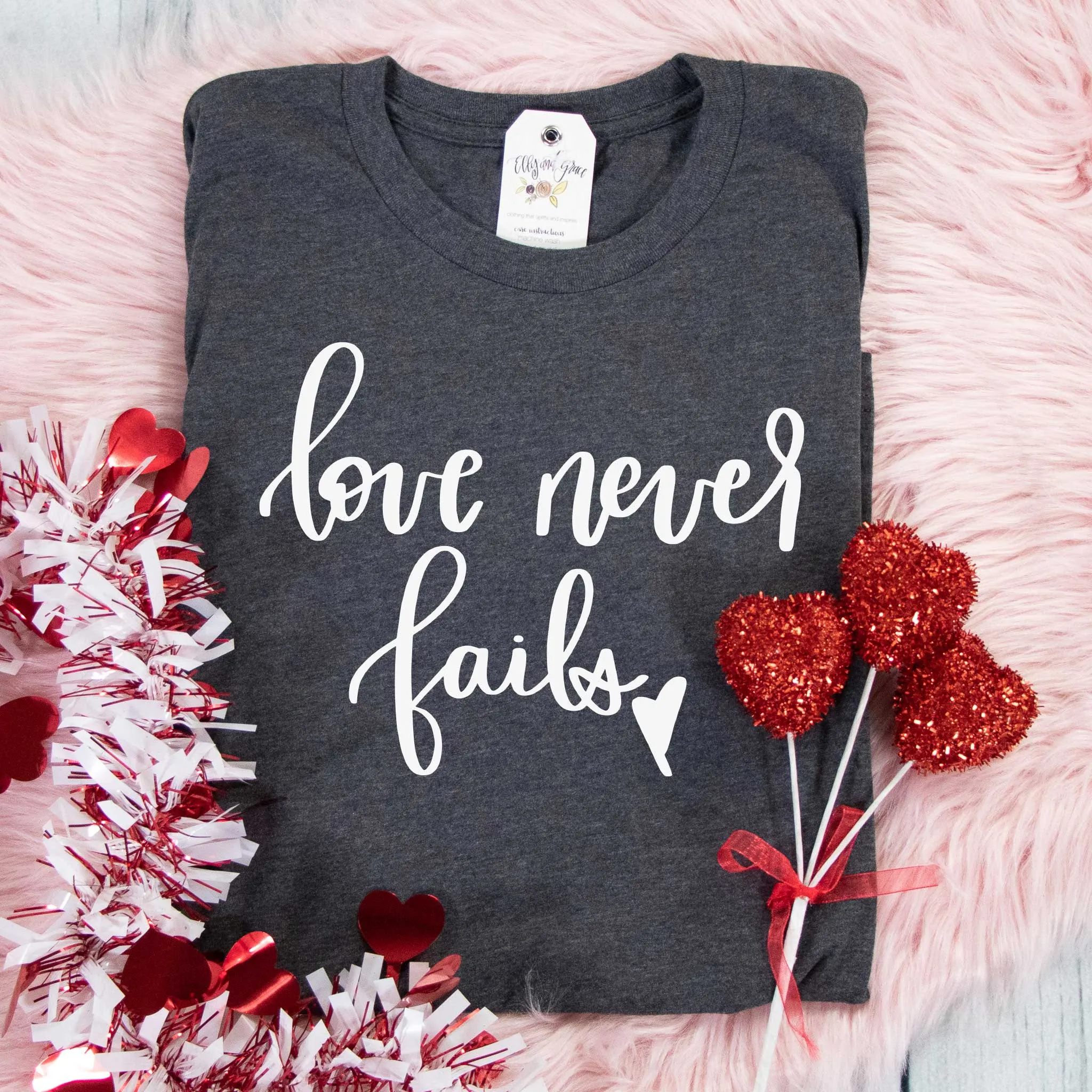 Love Never Fails Unisex Shirt